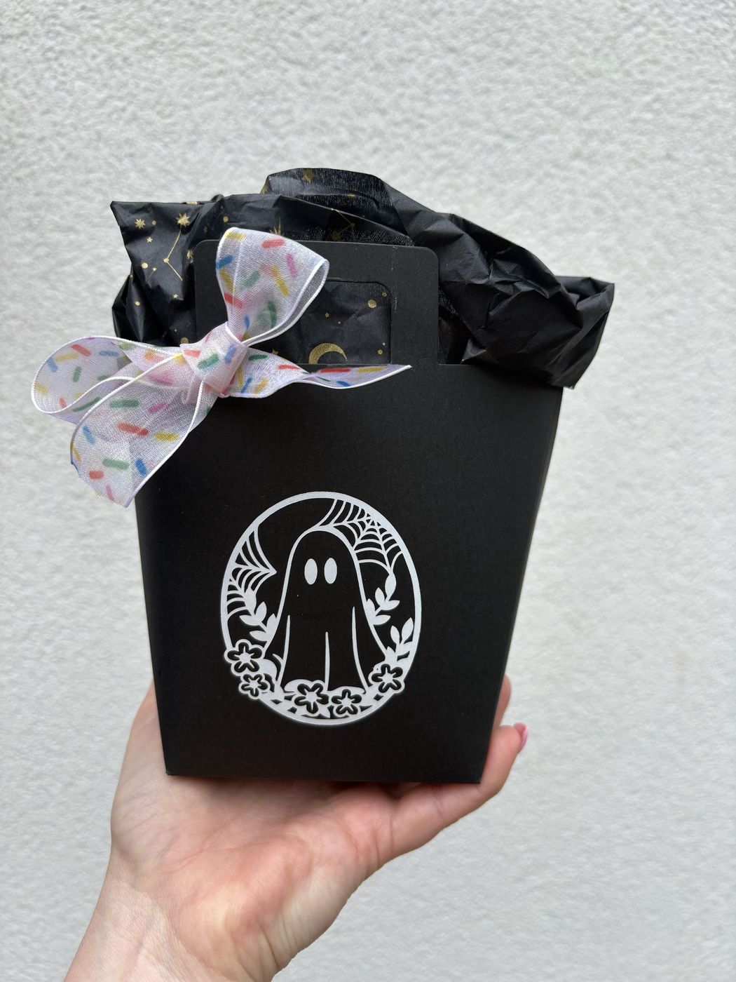 Black Halloween Boo Bag gift box with ghost design, tied with a sprinkle-print bow