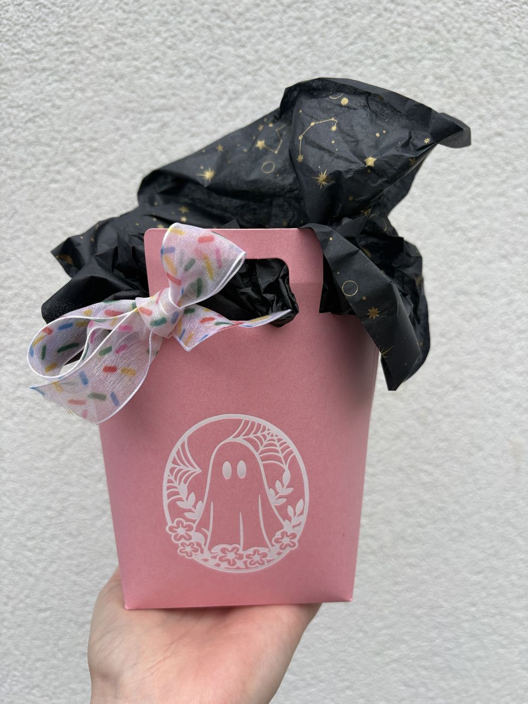 Pink Halloween Boo Bag gift box with ghost design, tied with a sprinkle-print bow