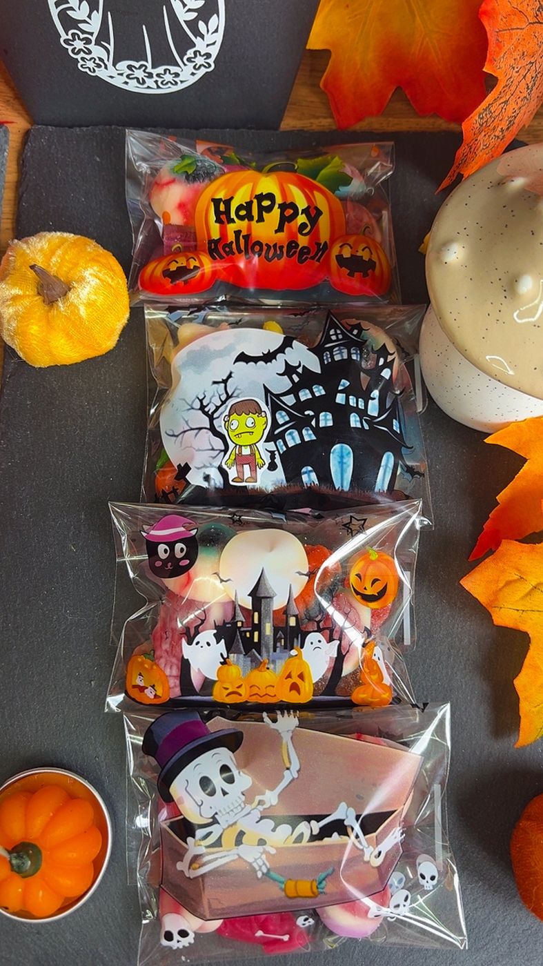Bags of assorted Halloween sweets with spooky Happy Halloween packaging