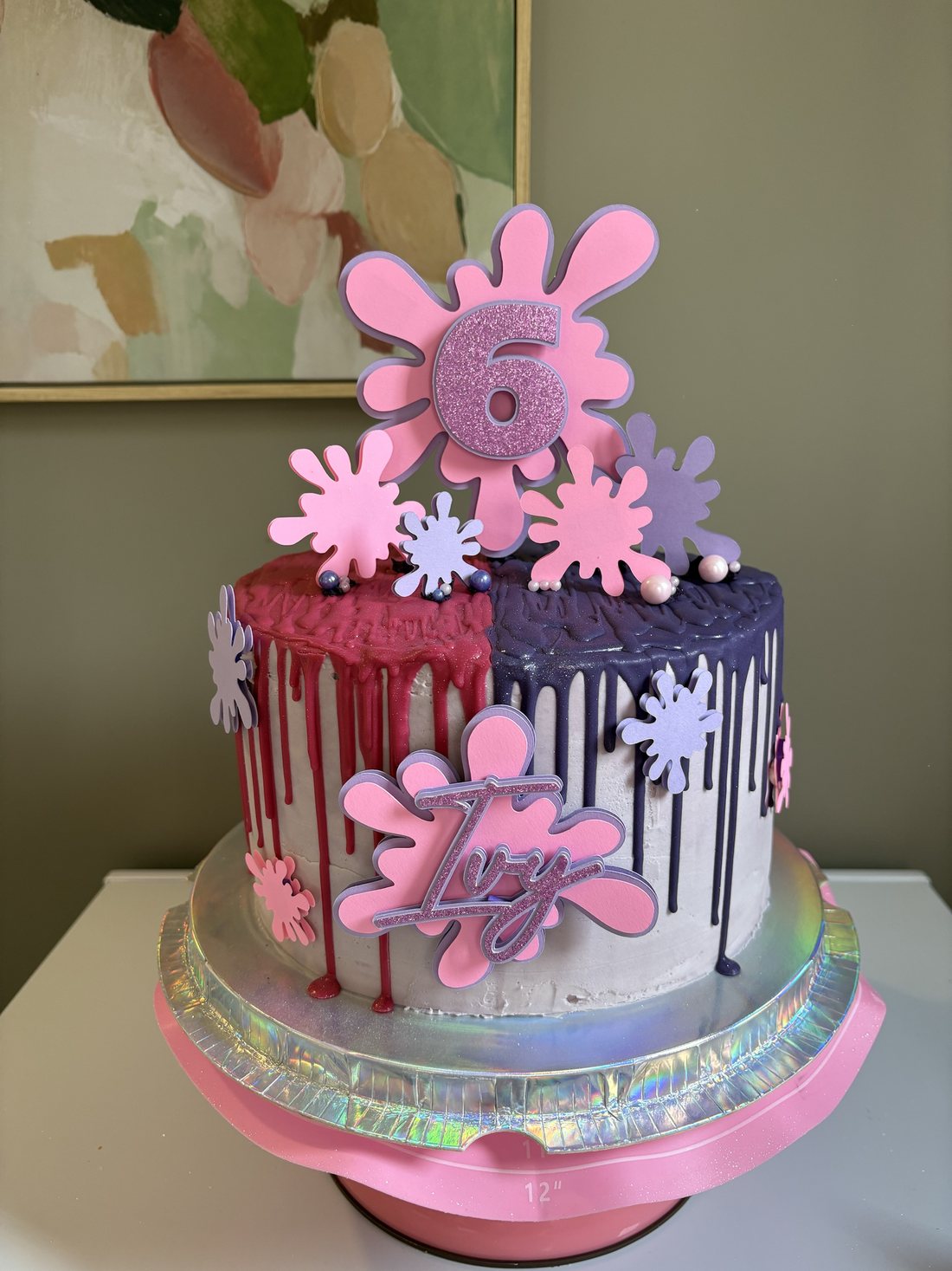Pink and purple slime themed drip cake with slime splat toppers, a glitter number 6 and a name topper