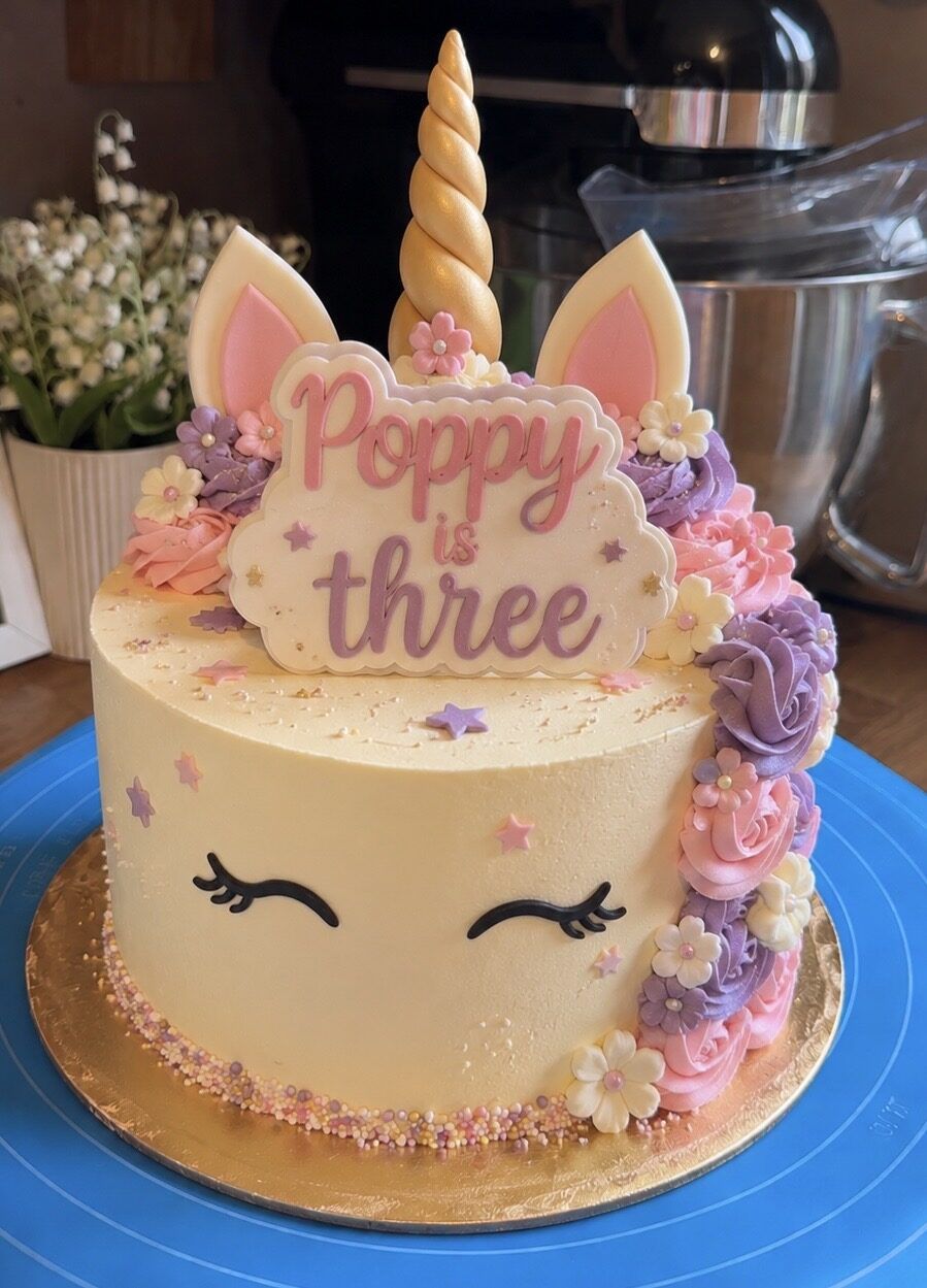 Unicorn themed 3rd birthday cake with pastel buttercream roses and gold horn
