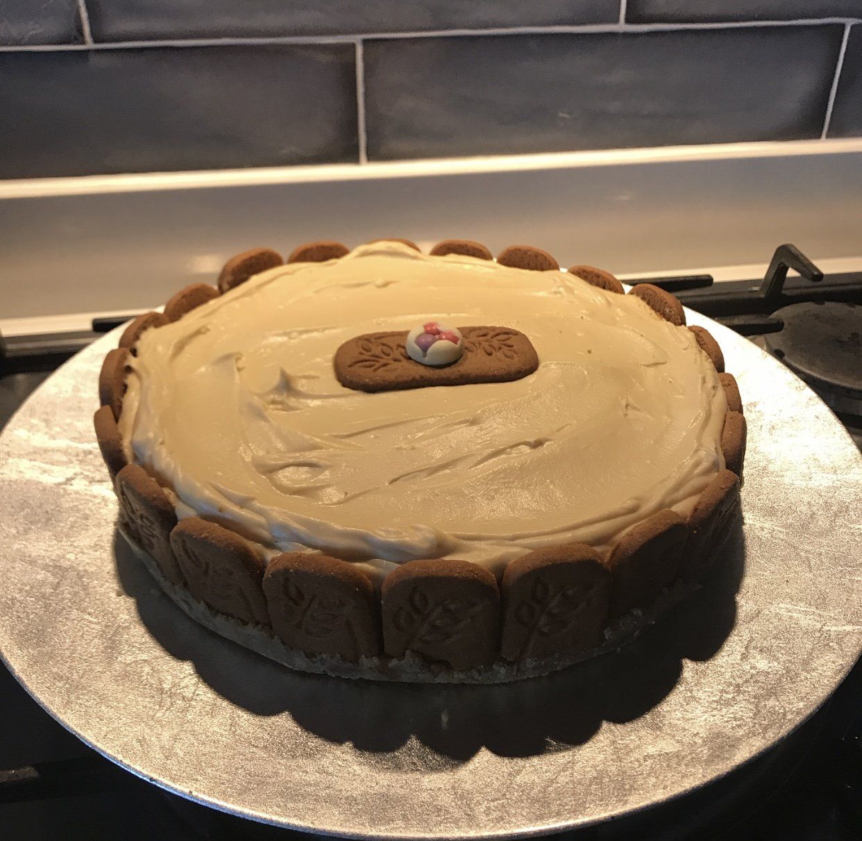 Whole Biscoff cheesecake with a Biscoff biscuit border and drizzle
