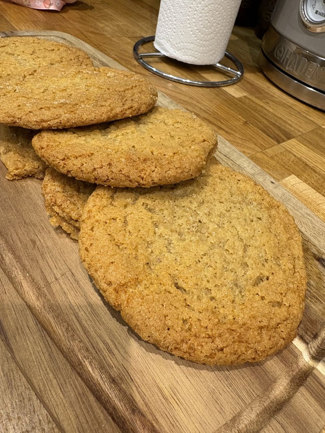 Classic golden sugar cookies cooling on a board