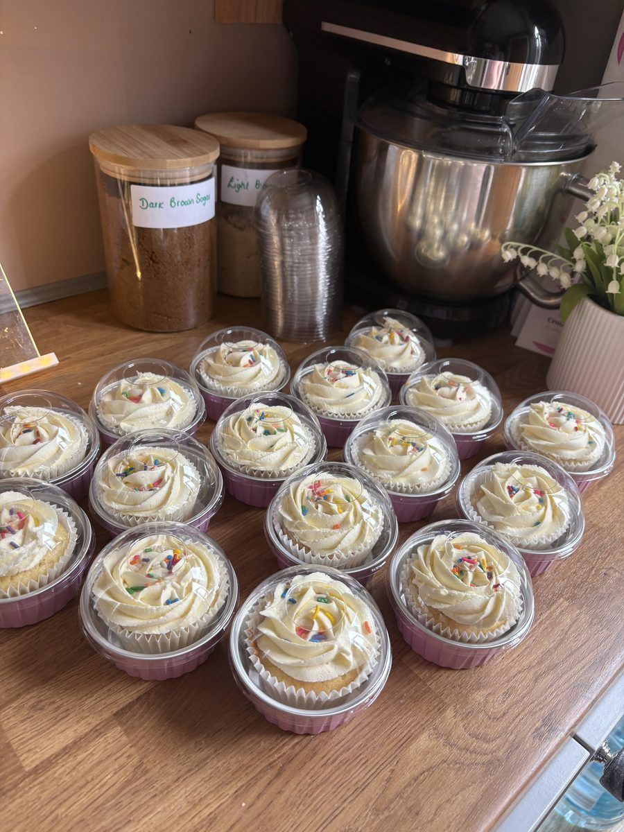Rows of individually boxed cupcakes ready for office collection
