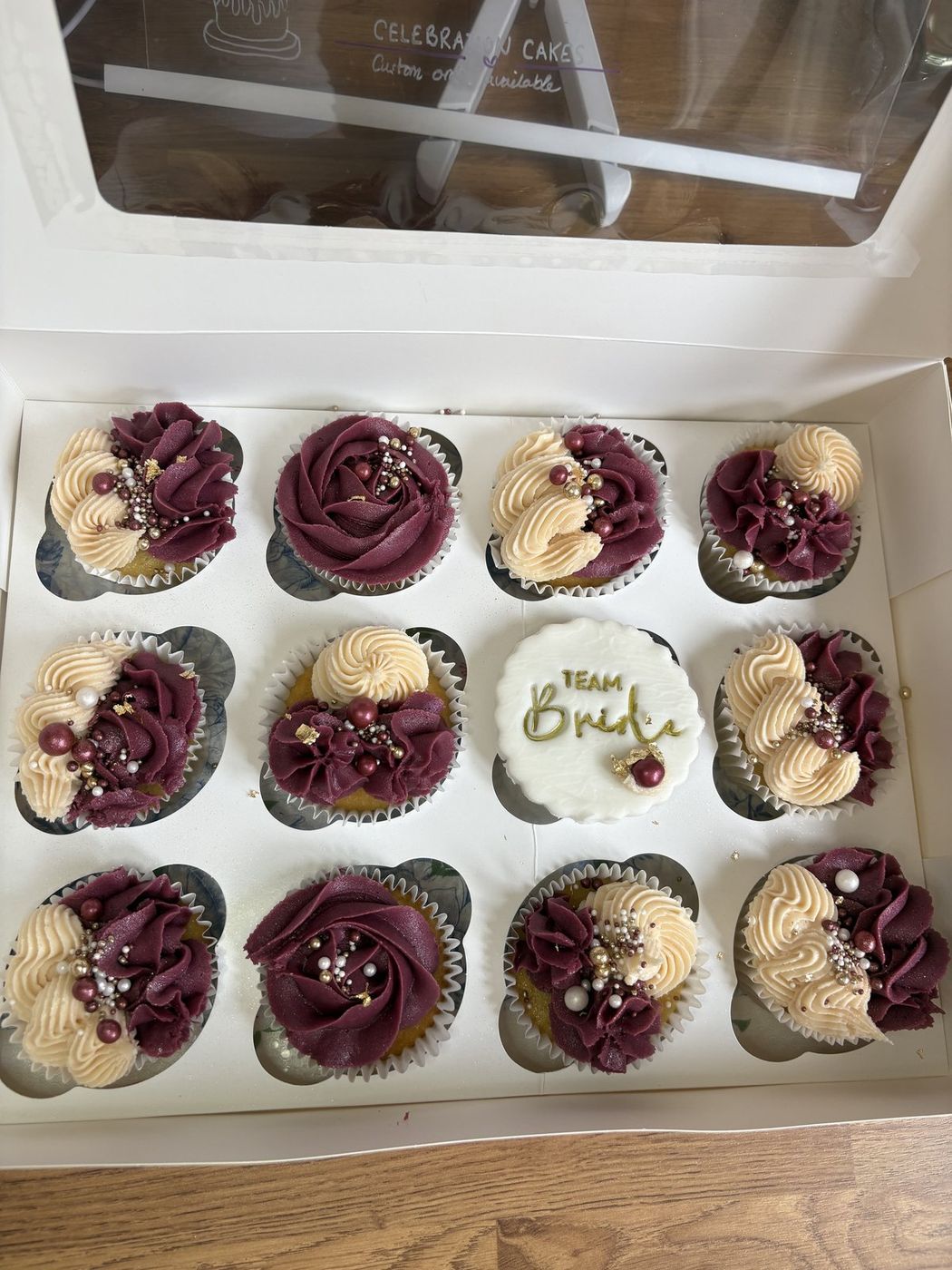 Burgundy and gold Team Bride cupcakes for a hen do