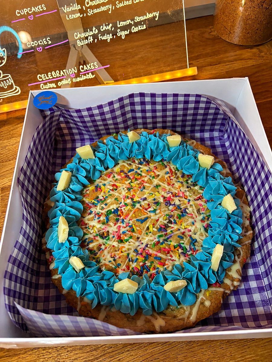 Giant loaded cookie with sprinkles and blue frosting